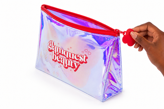 Transparent pouch with red zipper and 'Glamquest beauty' text on a white background