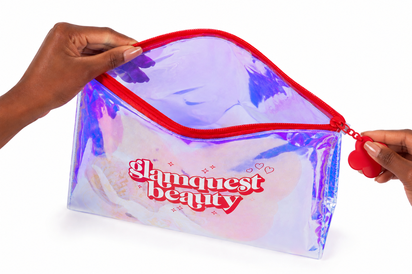 Hands opening a clear holographic waterproof pouch with a red zipper and 'Glamquest Beauty' branding, on a white background.